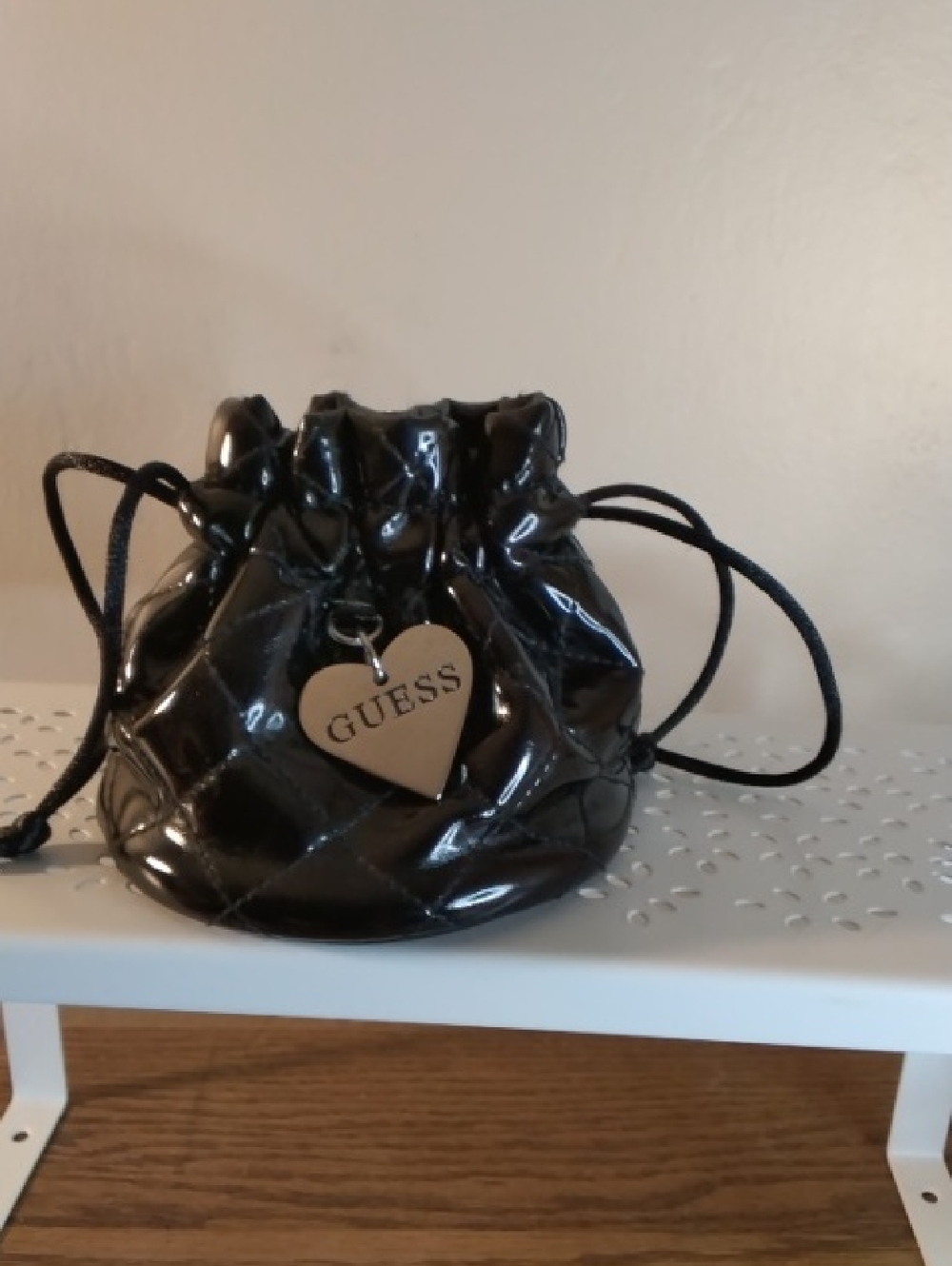 GUESS Black Quilted Patent Drawstring Pouch with Heart Charm